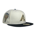 An off-white and black Arizona Diamondbacks fitted baseball cap featuring a gold and black 'A' logo on the front and a team patch on the side, set against a plain white background.